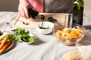 ingredients in bowls and balsamic being poured into a bowl